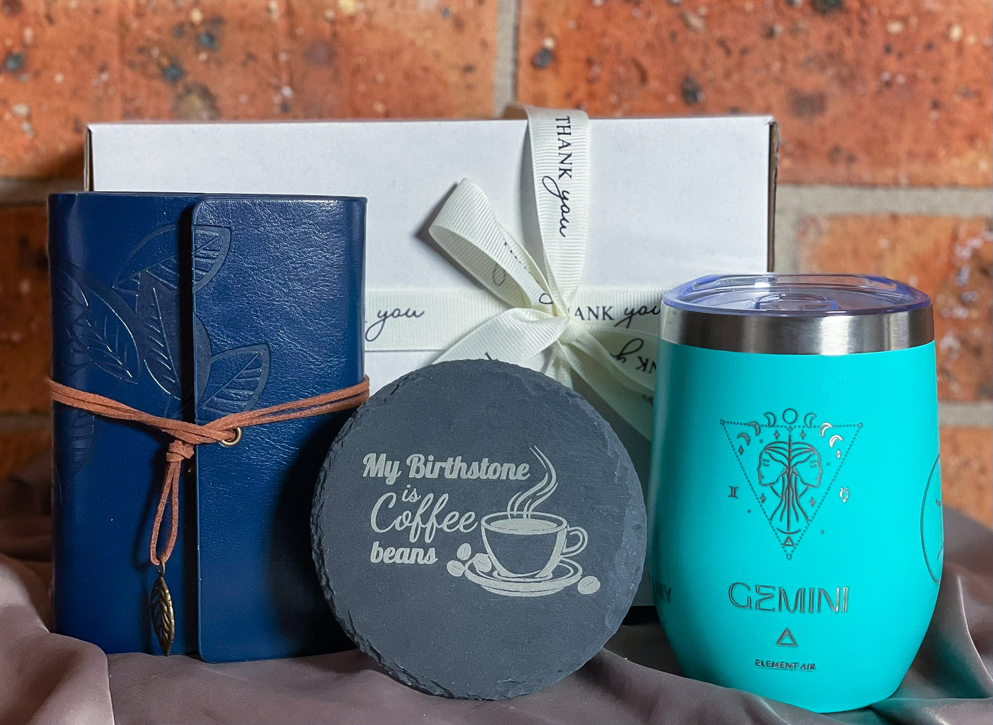 Personalised gift set with blue engraved astrology tumbler-blue turquoise faux leather travel journal engraved and engraved slate coaster.